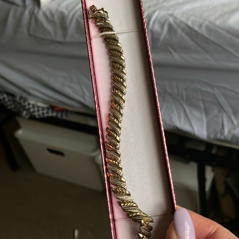 Beautiful breslet gold and diamond still sterling